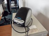 a black and silver phone sitting on top of a box