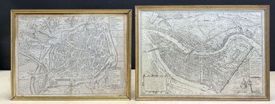 deux cartes encadrées de Paris et de la ville de Paris posées sur une table