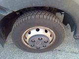 a close up of a flat tire on a car