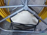 a bag that is inside of a bike basket
