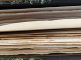 a stack of old books sitting on a table