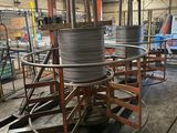 a large pile of wires on a cart in a warehouse
