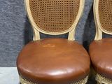 pair of antique french cane back chairs with leather upholstered seats