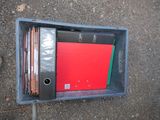a box with a bunch of folders in it on the ground
