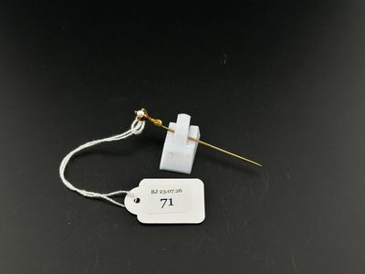 a close up of a white tag on a black surface