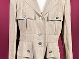 an image of a woman ' s jacket on a mannequin stand