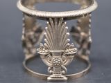 a close up of a silver ring on a table
