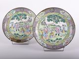 pair of chinese famille plates with figures in a landscape