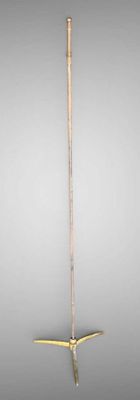an image of a sword that is standing on a table