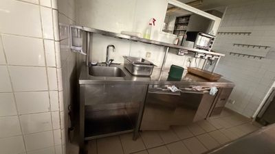 an image of a commercial kitchen with stainless steel appliances