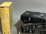 three books stacked on top of each other on a table