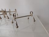 five pairs of scissors sitting on a clear surface