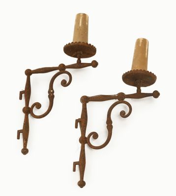 pair of antique cast iron sconces with candle holders