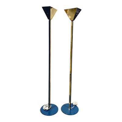 pair of brass and blue metal floor lamps