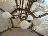 a chandelier that has a lot of lights hanging from it