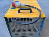 a yellow box with a hose on top of it