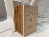 three books are stacked on top of each other on a white surface