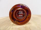 a glass object that is sitting on a wooden table