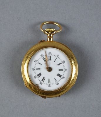 a gold pocket watch with roman numerals on it