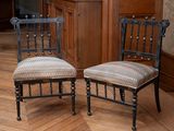 two chairs sitting next to each other on a hard wood floor