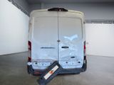 a van that has been vandalized in a garage