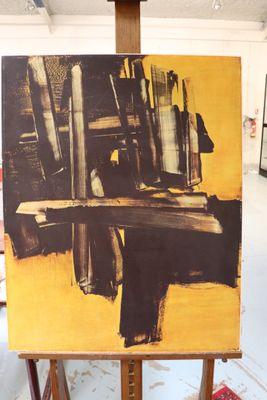 a picture of a painting on a easel in a room
