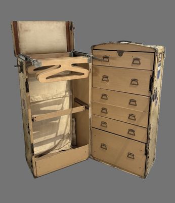 an open suitcase with a drawer inside of it