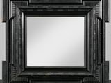 un miroir à cadre noir, composé d'un cadre en bois et d'un cadre métallique