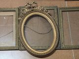 three frames that are sitting on the floor next to each other
