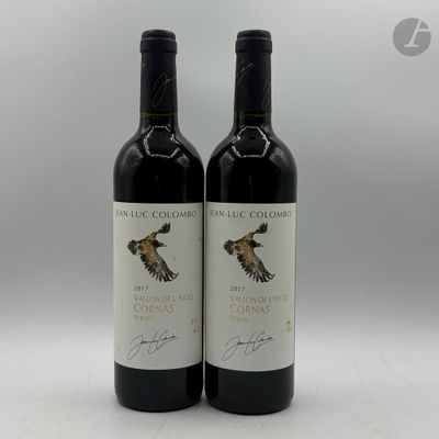 deux bouteilles de vin rouge avec un oiseau sur l'étiquette