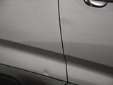 a close up of a car door handle with a sticker on it