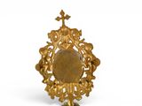 an image of a gold plate with a cross on it
