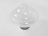 a small plastic object on a white surface