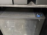 an image of a microwave oven in a cabinet