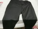 a pair of pants sitting on top of a bed