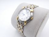 wrist watch on display on ring holder with white background