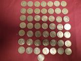 a lot of coins that are on a red cloth