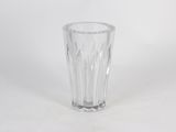 a clear glass vase sitting on a white surface