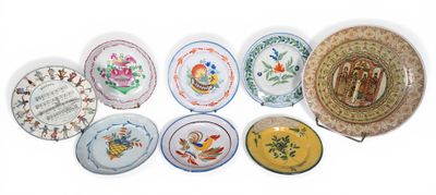 a lot of plates that are sitting on a table