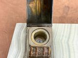 a small box that has a lighter inside of it