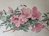 a picture of a painting of flowers on the wall