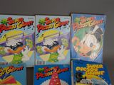 several children ' s books are lined up on a table