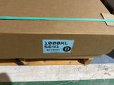 a cardboard box that has a green ribbon on it