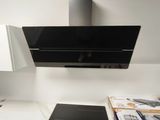 a black stove top oven sitting on top of a white counter