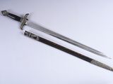 pair of two swords on a white surface with a white background