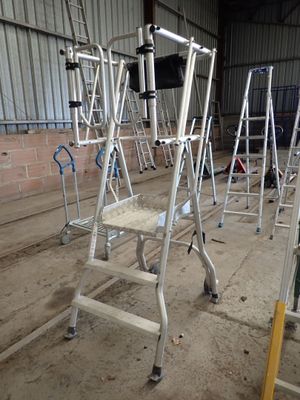 many ladders that are sitting in a building
