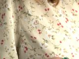 a woman that is holding a cell phone in her hand