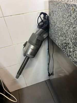 a vacuum that is sitting on the counter in the bathroom