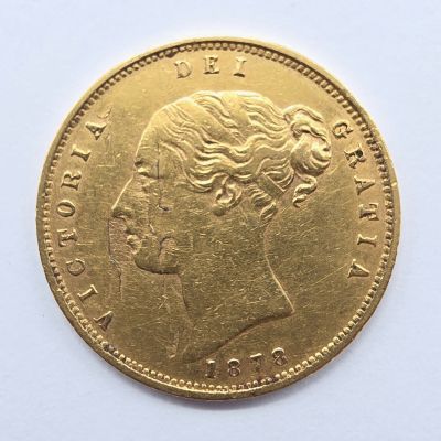 l'image d'une pièce d'or sur laquelle figure le visage d'une femme