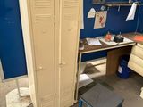 an image of a room with a desk and a locker